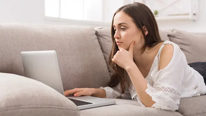 woman browsing the internet on her laptop