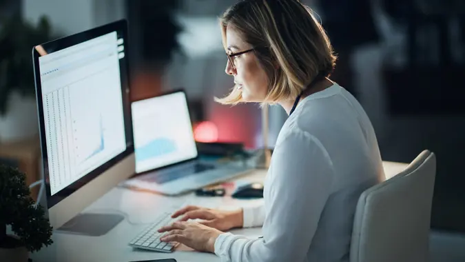 Shot of a businesswoman using a computer during a late night at work.