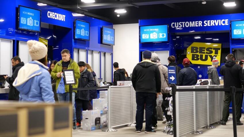 Coquitlam, BC, Canada - December 30, 2016 : People line up for buying gift at check out counter inside Best buy store.