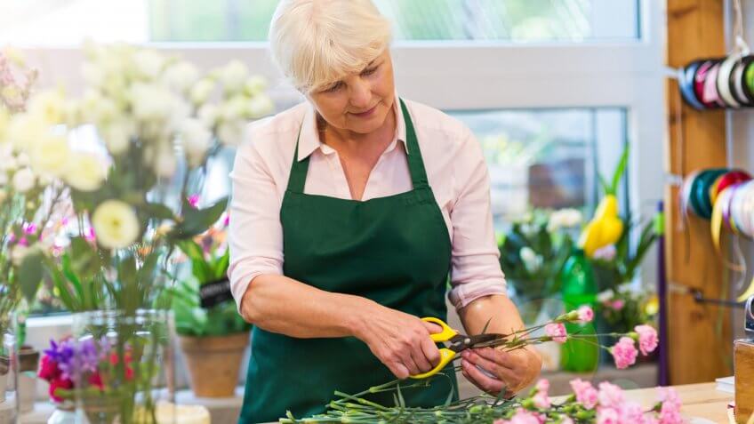 Woman working in florist shop.