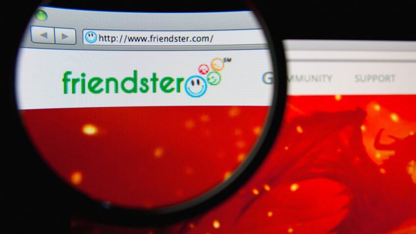 LISBON, PORTUGAL - MARCH 7, 2014: Photo of Friendster homepage on a monitor screen through a magnifying glass.
