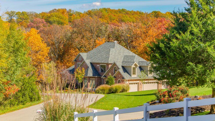 OKLAHOMA, UNITED STATES - OCTOBER 13, 2015 - houses along Route 66 in the fall with colorful trees near Oklahoma City.