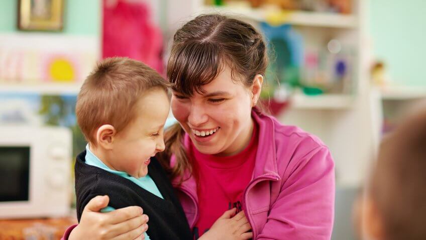 cheerful kids with disabilities in rehabilitation center.