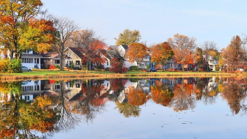 Beautiful fall landscape with a bridge in the city park.