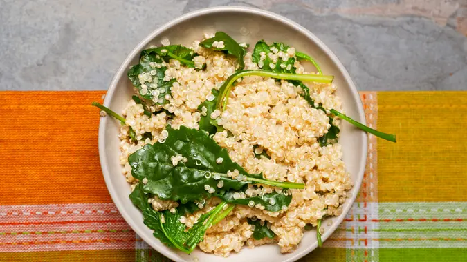 Healthy lunch dish of quinoa and kale.