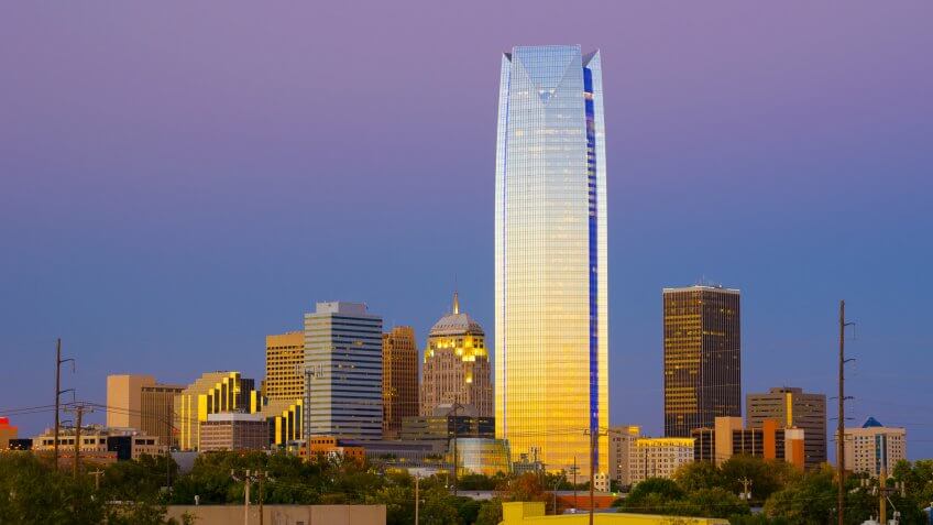 Oklahoma City skyline at dusk, prominently featuring Devon Tower.