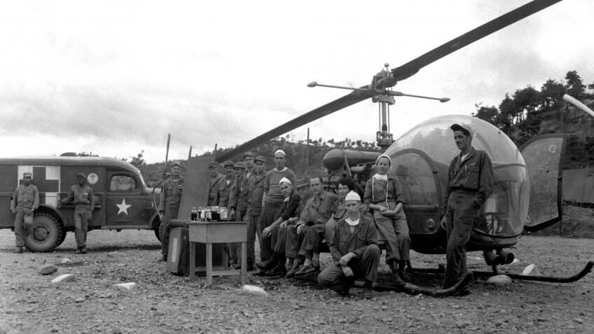 Personnel and equipment needed to save a man'life are assembled at HQs of the 8225th Mobile Army Surgical Hospital, Korea.