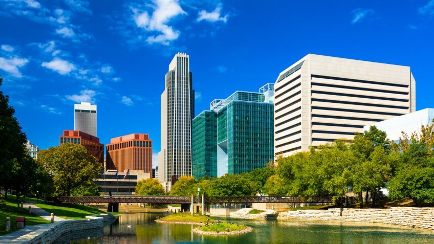 Downtown Omaha skyline with the Gene Leahy Mall in the foreground (including a reflective waterway / lagoon. Downtown Omaha skyline with the Gene Leahy Mall in the foreground (including a reflective waterway / lagoon.