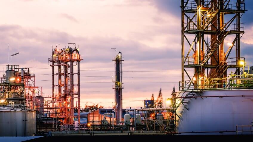 Petrochemical plant factory against the evening sunset sky
