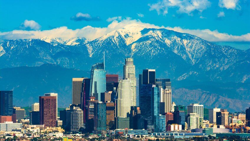 Downtown Los Angeles with the new Wilshire Grand skyscraper, Los Angeles’ tallest building by pinnacle, and with the snow-capped San Gabriel Mountains in the background. Downtown Los Angeles with the new Wilshire Grand skyscraper, Los Angeles’ tallest building by pinnacle, and with the snow-capped San Gabriel Mountains in the background.