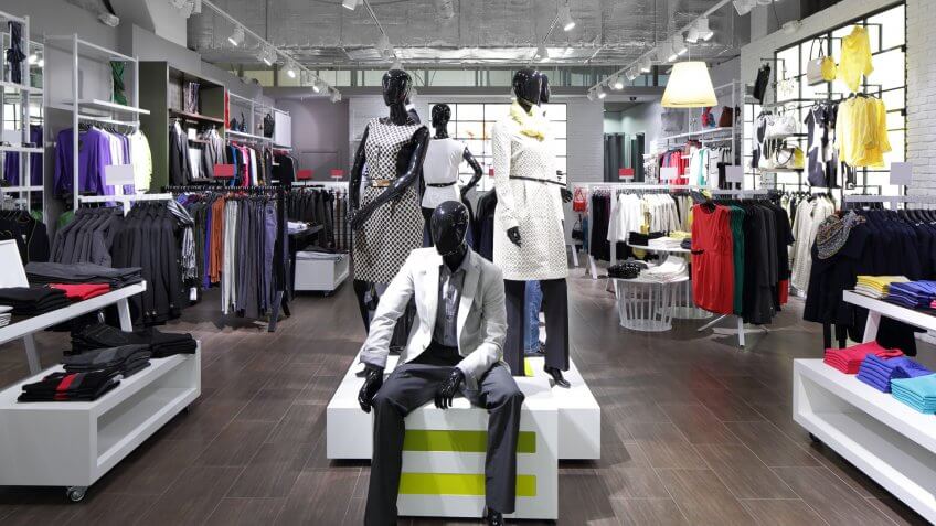 fashion store display with mannequins in clothes