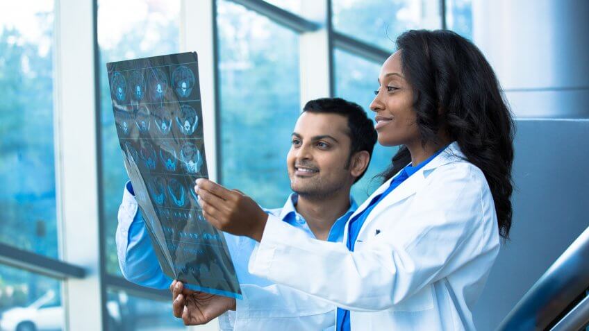 doctors looking at x-ray charts