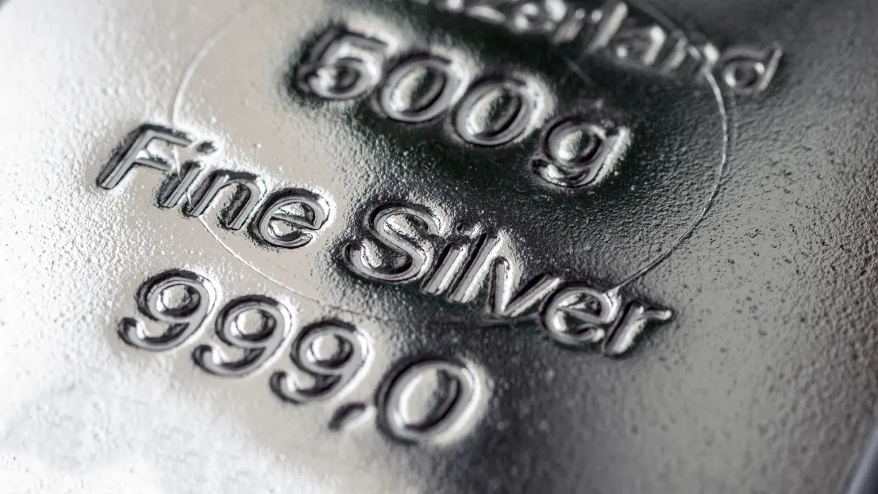 The surface of cast silver bullion. The texture of the surface of the silver bar. Selective focus. (shallow DOF)