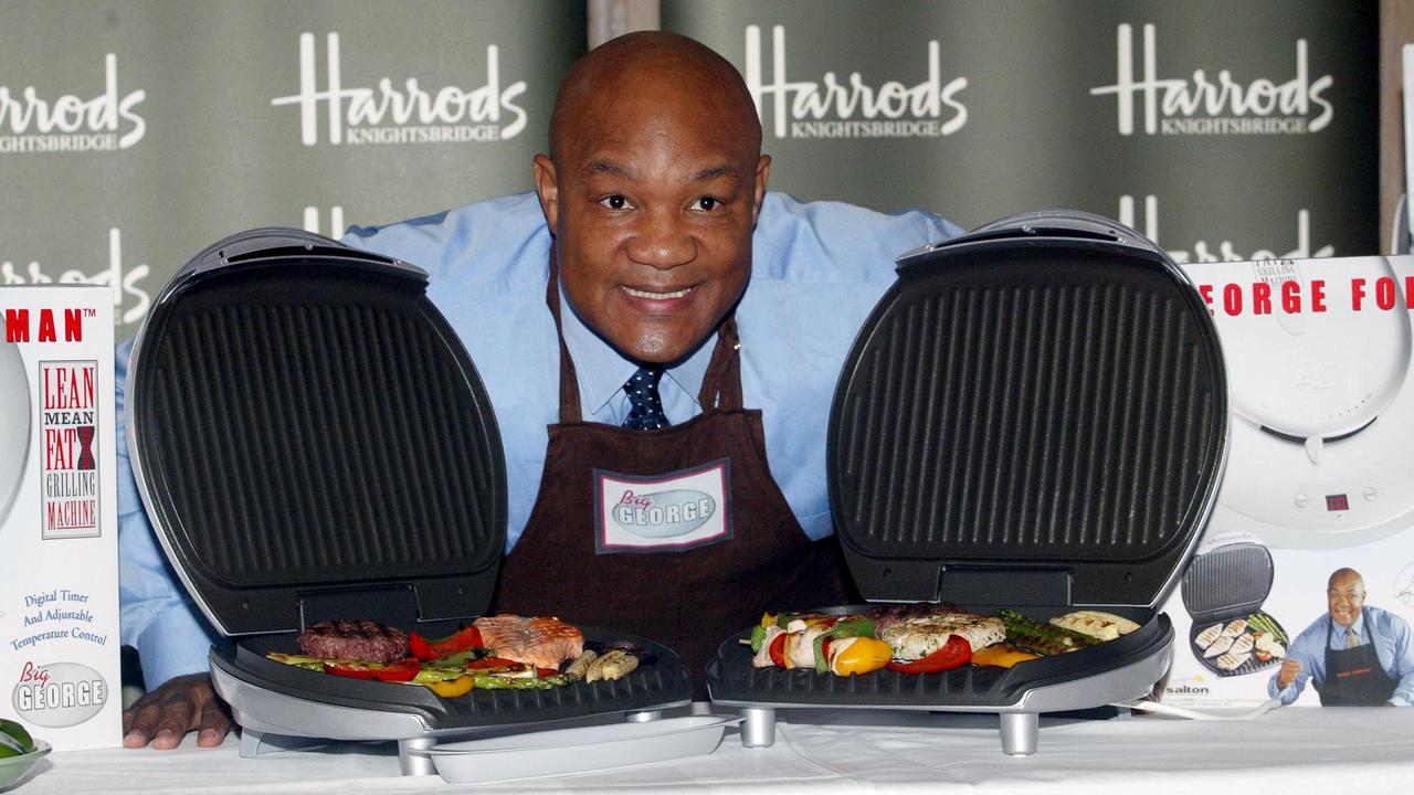 GEORGE FOREMAN SOME MEAT ON 'BIG GEORGE' - THE LATEST ADDITION TO HIS LEAN MEAN FAT REDUCING GRILLING RANGEGEORGE FOREMAN LAUNCHING 'BIG GEORGE', HARRODS, LONDON, BRITAIN - 12 NOV 2002.