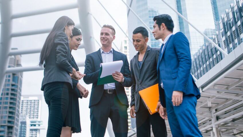 coworkers-standing-meeting