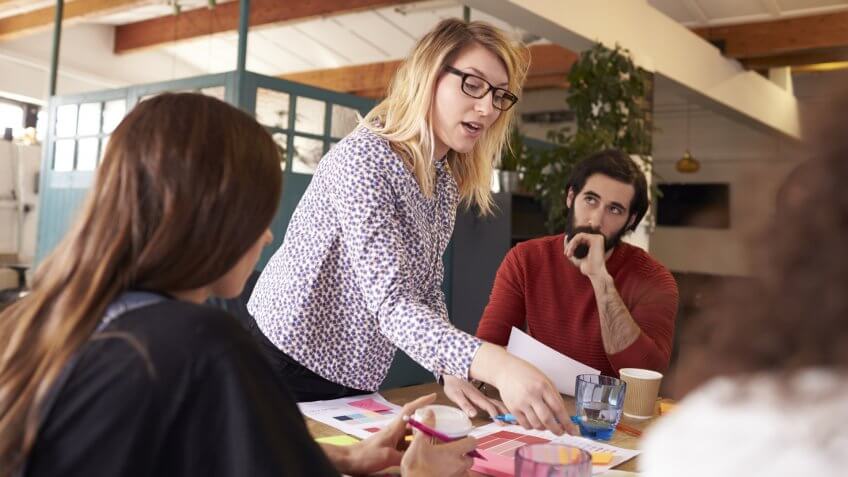 Female Manager Leads Brainstorming Meeting In Design Office.