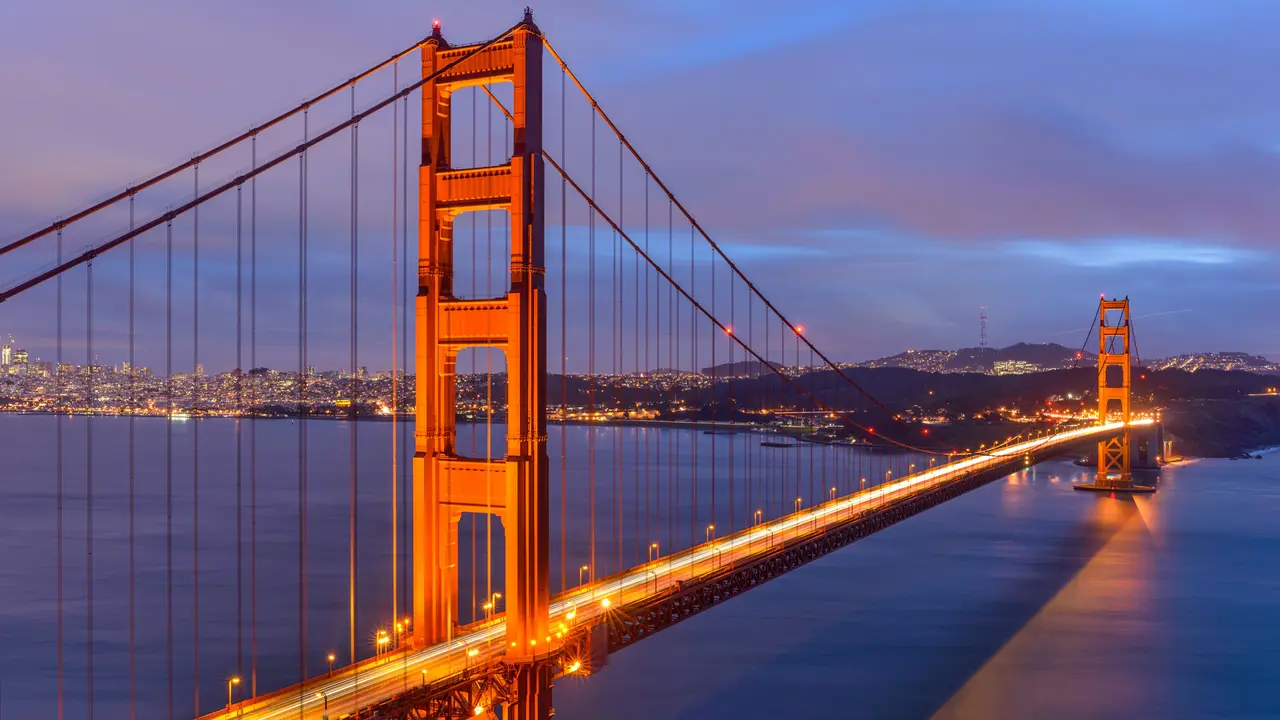 Sunset Golden Gate Bridge - A cloudy-winter-day sunset view of Golden Gate Bridge, looking from Hilltop at Marin Headlands toward San Francisco Peninsula at south.