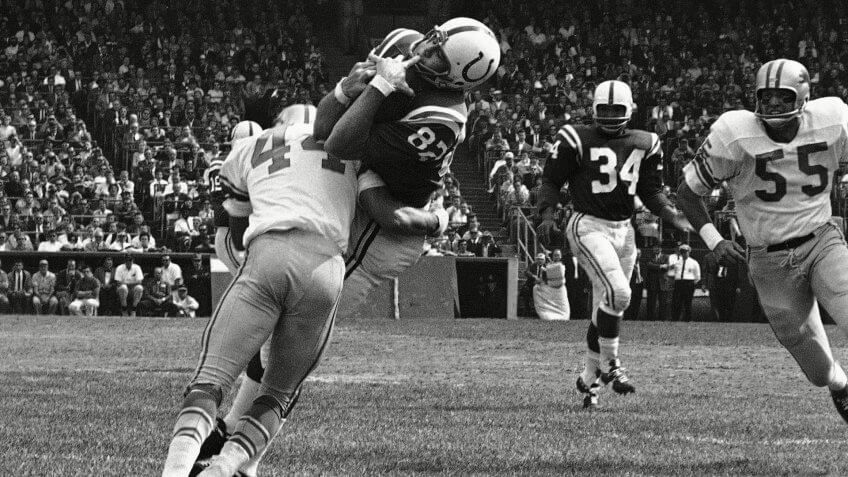 Mandatory Credit: Photo by Uncredited/AP/REX/Shutterstock (6030592a)Baltimore Colts end Raymond Berry snags a pass from quarterback John Unitas for 5-yard gain against the Detroit Lions in a football game in Baltimore.