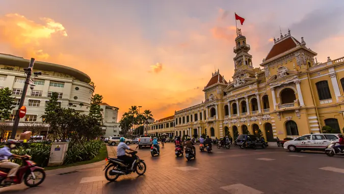 HO CHI MINH CITY,VIETNAM - DEC 10: Traffic in front of Ho Chi Minh City Hall at twilight on December 10,2015 in Ho Chi Minh City,Vietnam.