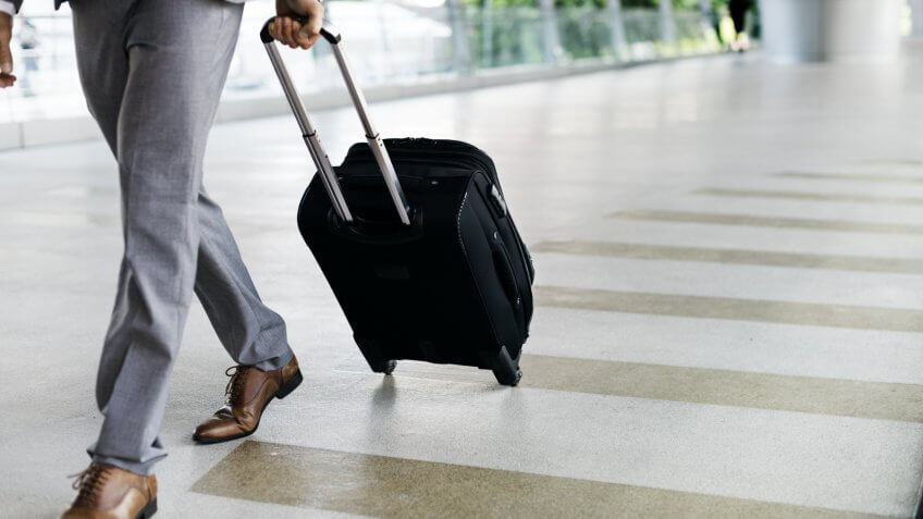 Businessman walking with luggage