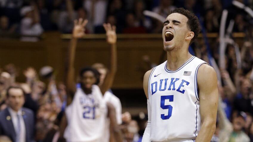 Mandatory Credit: Photo by Gerry Broome/AP/REX/Shutterstock (6106083a)Tyus Jones, Amile Jefferson Duke's Tyus Jones (5) and Amile Jefferson (21), rear, react following Jones' basket against Notre Dame during the first half of an NCAA college basketball game in Durham, N.