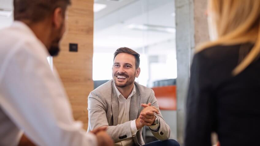 smiling in office.