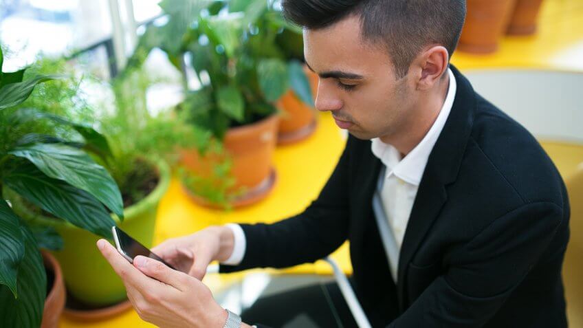man looking at smartphone