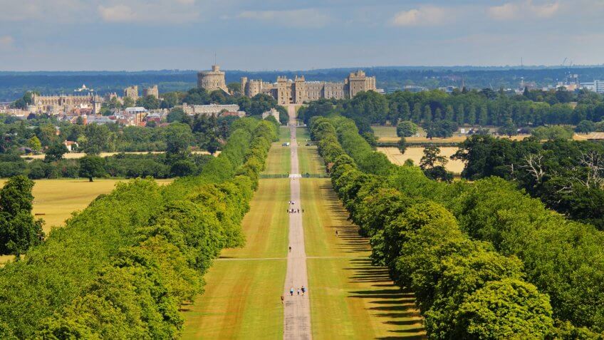 The Long Walk in Windsor Great Park in England with Windsor Castle in the background.