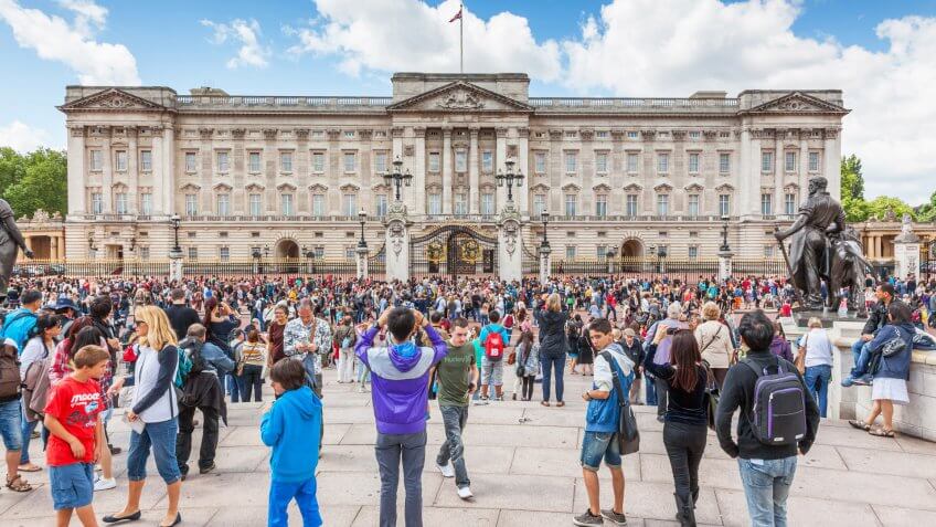 Crowds gather outside Buckingham Palace to watch the changing of the guard ceremony.