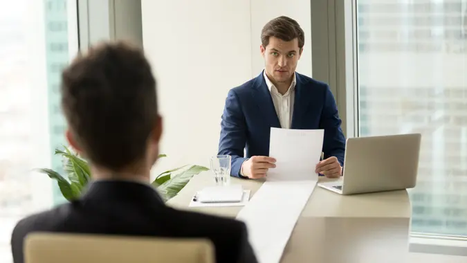 man reading a long list