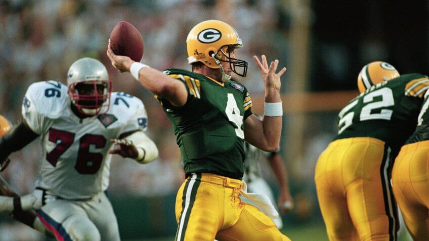 Mandatory Credit: Photo by Roberto Boreo/AP/REX/Shutterstock (6523861a)Green Bay Packers quarterback Brett Favre passes under pressure from New England Patriots' John Washington during the first quarter on Aug.