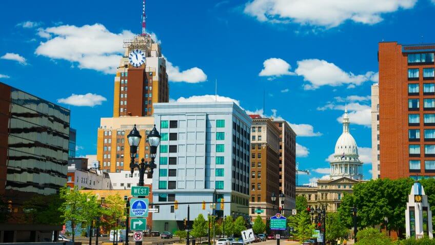 Lansing downtown skyline (with the Boji Tower on the right) with the Michigan State Capitol building in the back.