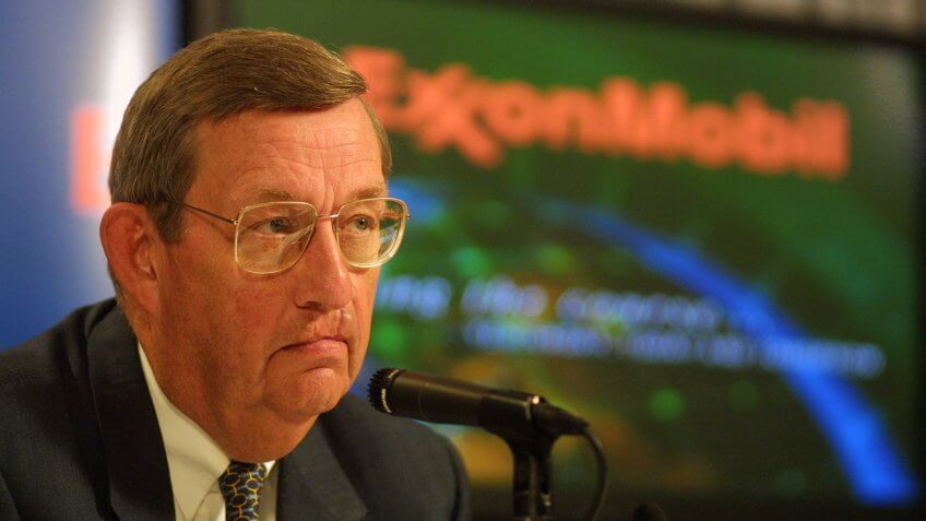 Lee Raymond, chairman of Exxon Mobil, speaks to reporters and analysts at the company's headquarters in Houston.