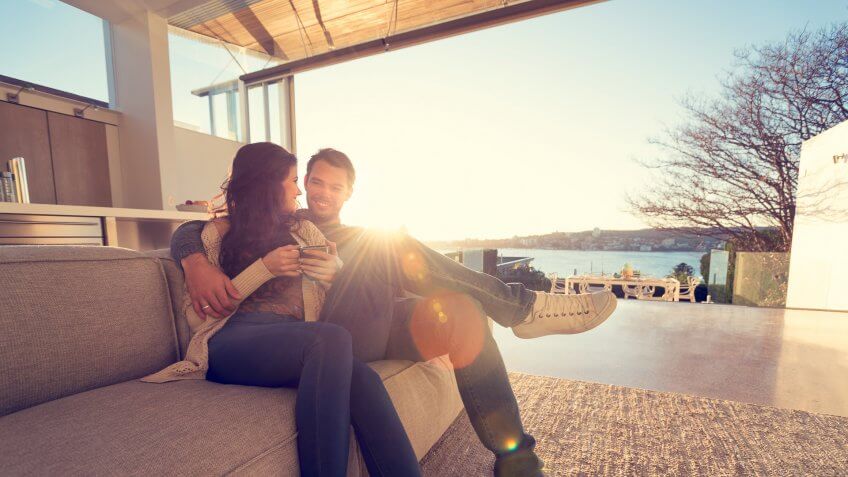 Couple on the sofa at sunrise.