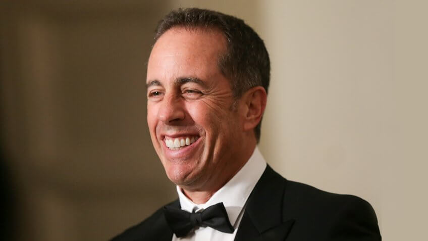 WASHINGTON, DC - OCTOBER 18: Comedian Jerry Seinfeld speaks to members of the media as he arrives at the White House for a state dinner October 18, 2016 in Washington, DC.