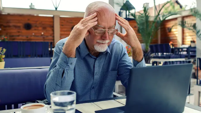 senior man using laptop