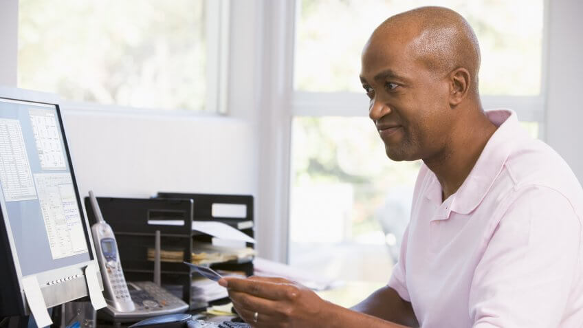 man-paying-credit-card