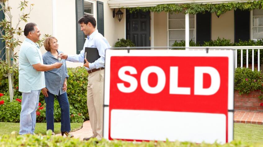 Senior couple buying new home