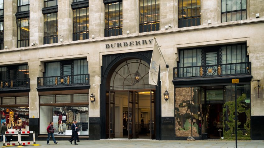 London, England - September 8, 2015: A few people walking past the Burberry store in Regent Street, Central London, on an overcast day.