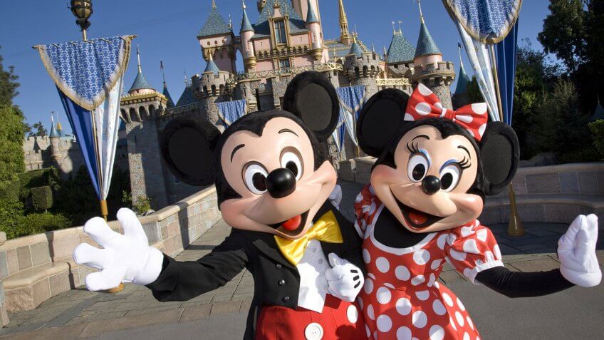 MICKEY & MINNIE -- Standing in front of Sleeping Beauty Castle at Disneyland, where magical storybooks come alive, Mickey Mouse and Minnie Mouse welcome visitors from all over the world.