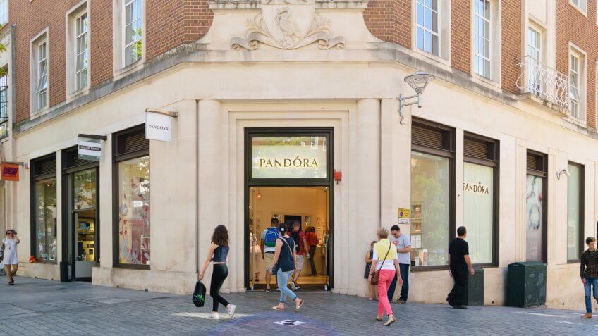 Exeter, Devon, United Kingdom - August 23, 2016: People pass by Pandora store in Exeter.