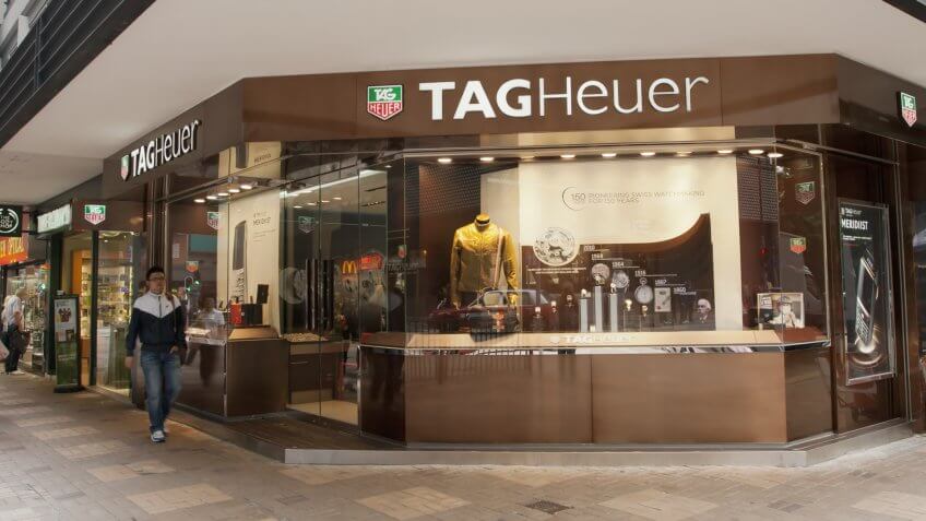 Hong Kong, China - November 24, 2010: A man walks past a store of the Swiss luxury watch maker TAG Heuer in Kowloon, Hong Kong.