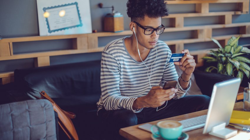 Young man working at home office.