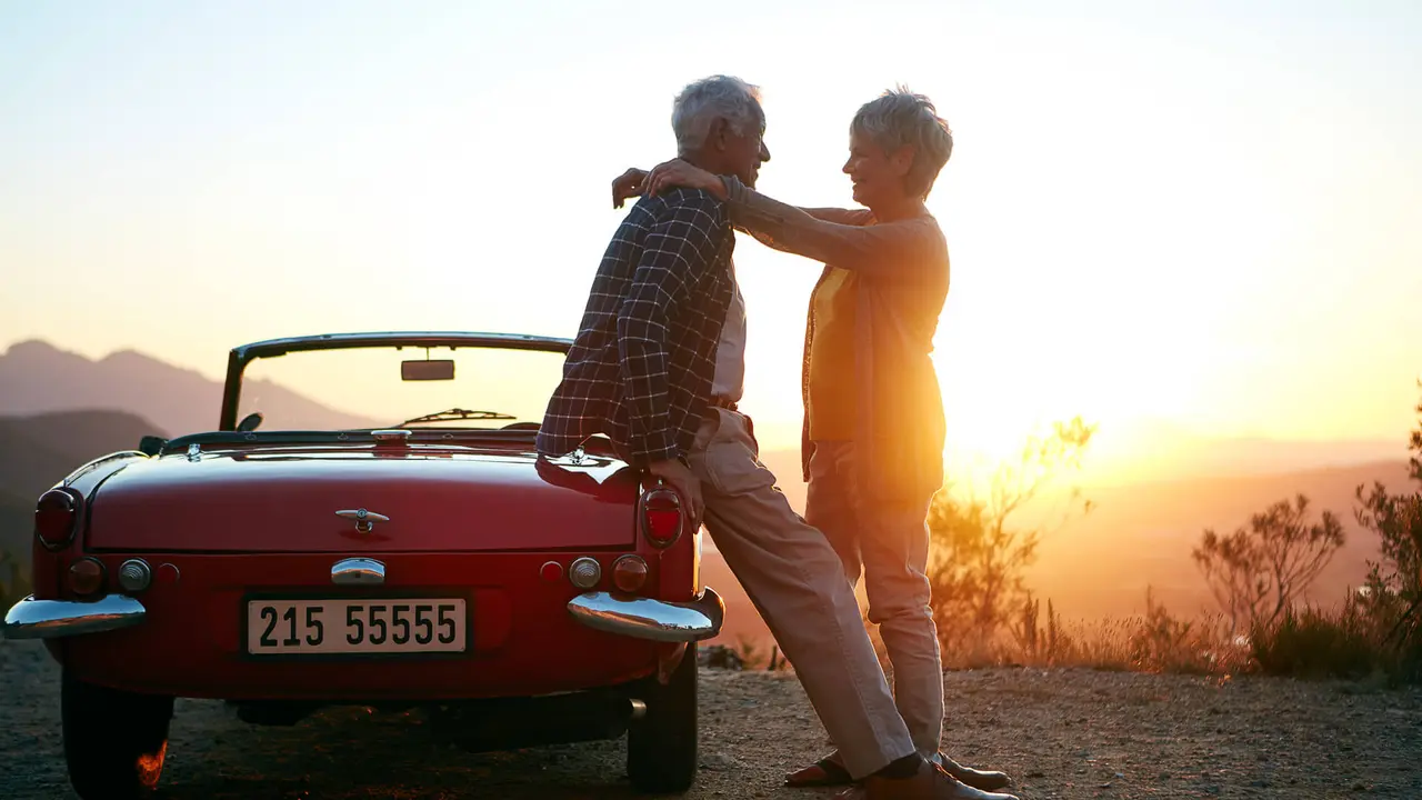 Shot of an affectionate senior couple enjoying the sunset during a roadtrip.
