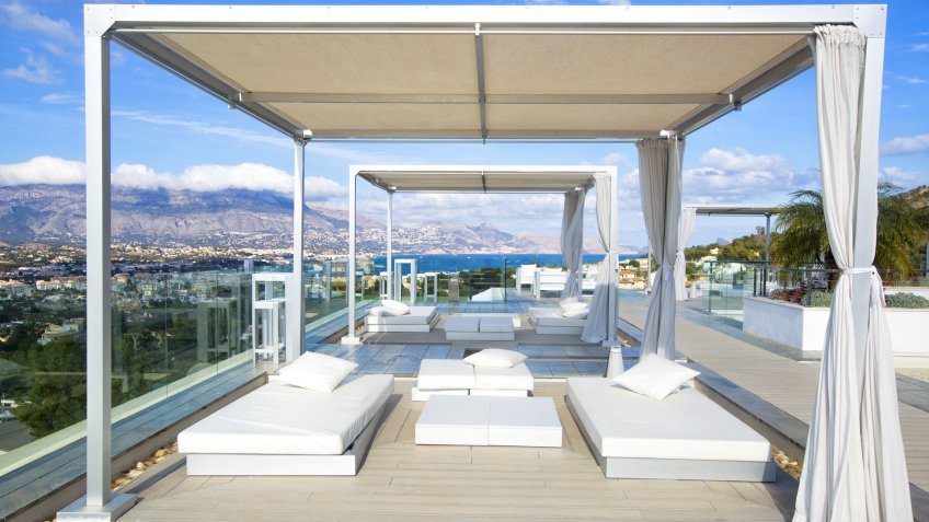 ALBIR,SPAIN - FEBRUARY 19, 2016: Swimming pool area with white sun beds in SHA Wellness Clinic.