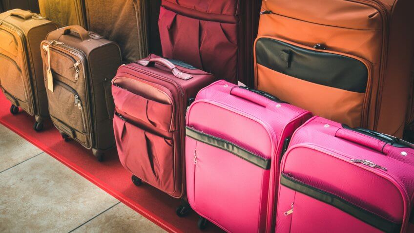 Luggage consisting of large suitcases rucksacks and travel bag.