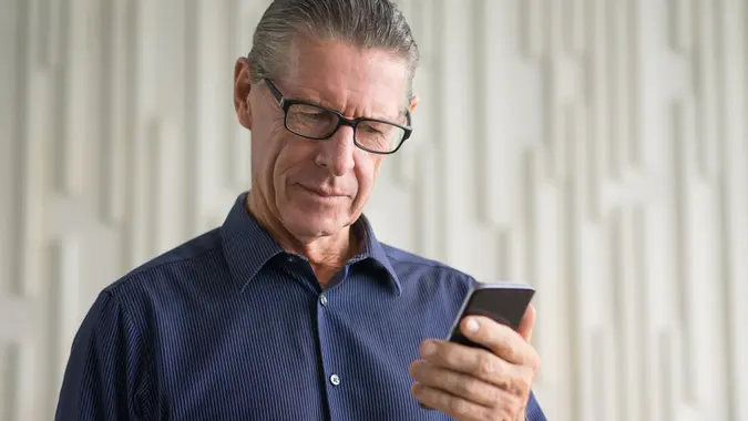 MAN, concerned, elderly, senior, smartphone