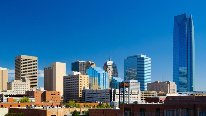 Oklahoma downtown skyline with a deep blue sky, featuring the new Devon Energy Center building.