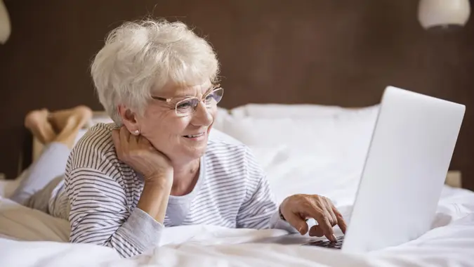 Computer, bed, elderly, laptop, senior, woman