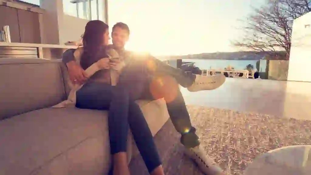 Couple on the sofa at sunrise.